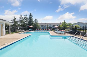 Sparkling outdoor pool with sundeck