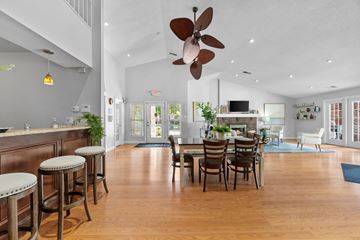 Town And Country apartment for rent - A large open living room with a dining table and chairs.