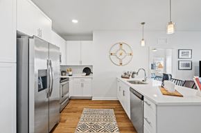 Shakopee apartment for rent - Fully Equipped Kitchen with White Cabinets