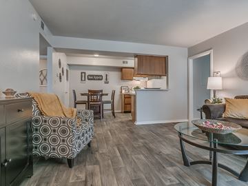 Tulsa apartment for rent - a living room and kitchen with a couch and a table