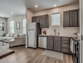 Springdale apartment for rent - Kitchen with Dark Brown Cabinetry and Stainless Steel Appliances