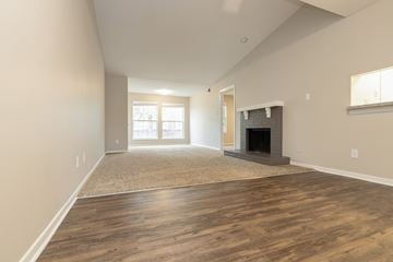 Chesterfield apartment for rent - A living room with a fireplace and a rug on the floor.