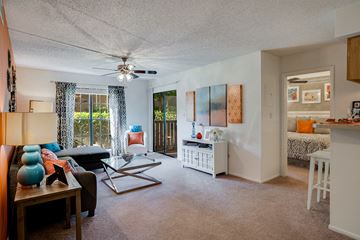 Daytona Beach apartment for rent - a living room with a couch and a ceiling fan