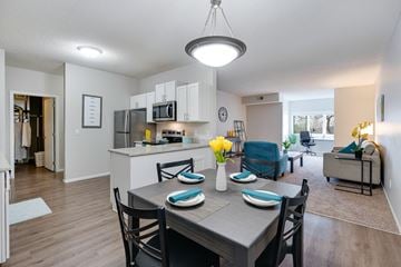 Bloomington apartment for rent - a dining room and living room with a table and chairs