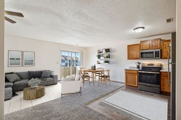 Cedar Rapids apartment for rent - a living room with a couch and a table