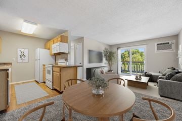 Cedar Rapids apartment for rent - a living room and dining room with a table and chairs