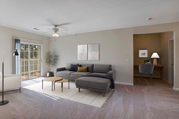Ofallon apartment for rent - A living room with a grey couch and a white coffee table.