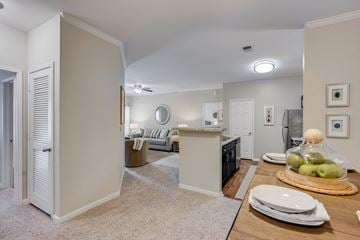 Knoxville apartment for rent - a living room with a dining room table and a kitchen