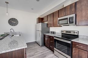 Woodbury apartment for rent - Kitchen With Granite Countertops & Stainless Steel Appliances