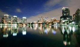 Ankeny apartment for rent - a city skyline at night over a body of water