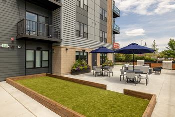 Two outdoor patios with kitchens and firepits