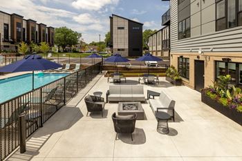 Two outdoor patios with kitchens and firepits