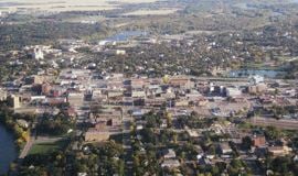 Ankeny apartment for rent - an aerial view of a city with buildings and a lake