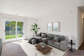 Southgate apartment for rent - A living room with a grey couch and a coffee table.