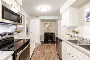 Shawnee apartment for rent - Renovated Kitchen with Stainless Steel Appliances, White Cabinets and Wood Style Flooring