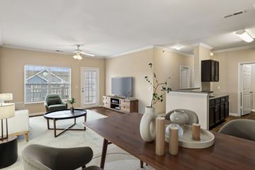 Smyrna apartment for rent - A living room with a brown table and a television.