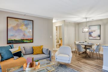 Eureka apartment for rent - A living room with a grey couch, a coffee table, and a painting on the wall.