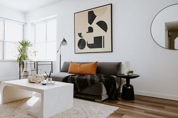 Cleveland apartment for rent - a living room with a couch and a white coffee table