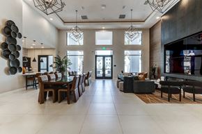 Redlands apartment for rent - A modern dining room with a long table and chairs.
