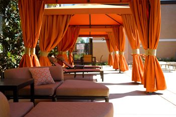 Resort-style pool, lounges, spa, and private cabanas