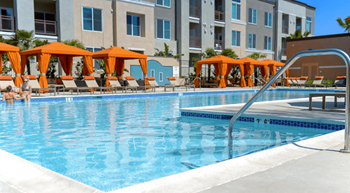 Resort-style pool, lounges, spa, and private cabanas