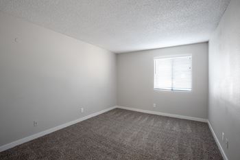 An empty bedroom with a window