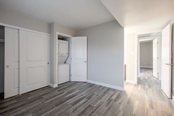 An empty room with a washer and dryer