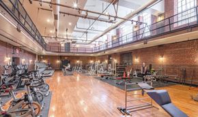 Philadelphia apartment for rent - the gym atrium has a lot of exercise bikes and other fitness equipment