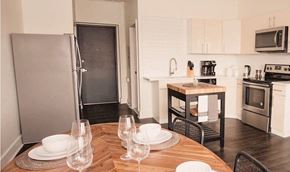 Philadelphia apartment for rent - a kitchen and dining room with a wooden table