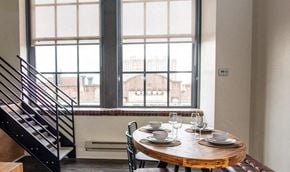 Philadelphia apartment for rent - a dining room with a table and chairs in front of a window
