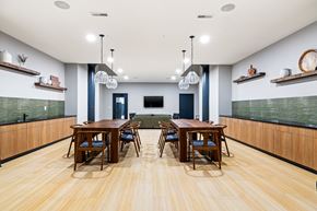 Philadelphia apartment for rent - a dining room with wooden tables and chairs and a green couch