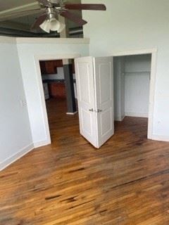 Madison Heights apartment for rent - A room with a ceiling fan and a wooden floor.
