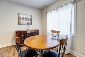 Newport News apartment for rent - A dining room with a wooden table and chairs. at Ada Park Apartments, Newport News, VA, 23601
