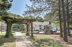 Concord apartment for rent - Play ground with slides and wooden pergola at Brooke Pointe Apartments, Concord, NC, 28027