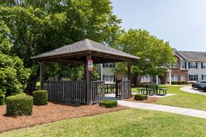 Lumberton apartment for rent - A gazebo is surrounded by bushes and a fence at Carriage Hills, Lumberton, NC 28358