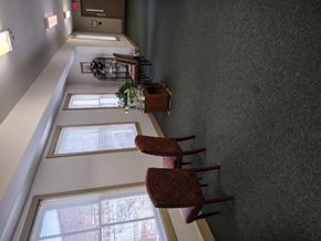 Henderson apartment for rent - Hallway with Chairs at Vance Senior Housing Apartments, Henderson, 27536