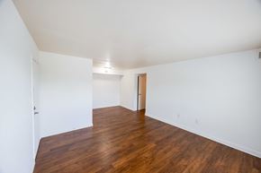 Marion apartment for rent - A room with wooden floors and white walls.