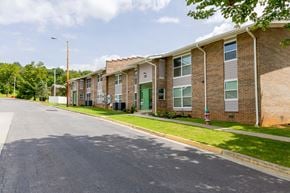 Marion apartment for rent - A street view of a residential area with apartment buildings on the right.