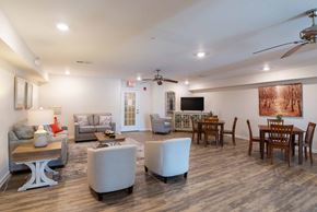 Staunton apartment for rent - A living room with a white couch, a coffee table, and a television.