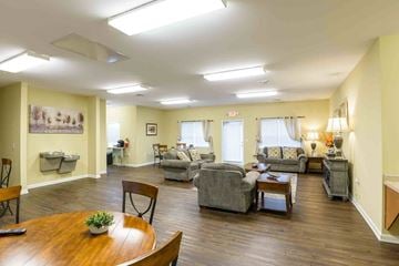 Harrisonburg apartment for rent - A living room with a wooden table and chairs.