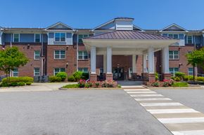 Newport News apartment for rent - Main Entrance with Covered Drop-Off Area at Snowden Senior Apartments, Newport News, VA