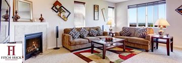 Greenville apartment for rent - A living room with a fireplace and a couch.