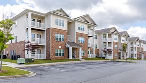 Stonecrest apartment for rent - Apartment buildings with a mix of brick and siding exteriors.