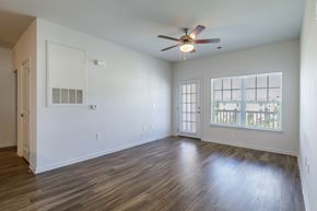 Stonecrest apartment for rent - A room with a ceiling fan and a window with blinds.