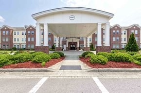 Rolesville apartment for rent - The entrance to a building  at The Grande at Granite Falls LLC Apartments, Rolesville, NC, 27571
