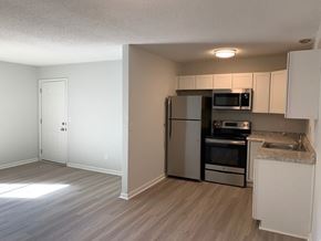 Summerville apartment for rent - A kitchen with a refrigerator, oven, and microwave.at Summerville Garden, Summerville