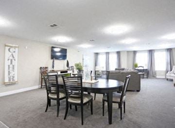 Huntersville apartment for rent - a living room with a table and chairs