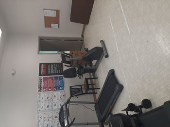 Gym room with a treadmill