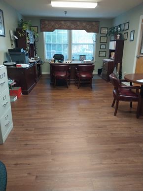 Wendell apartment for rent - A room with wood floors and furniture.