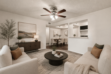 Glendale apartment for rent - A living room with a white couch, a coffee table, and a ceiling fan.